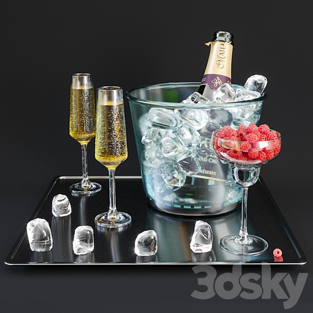 A bottle of champagne on a tray with ice and raspberries.
