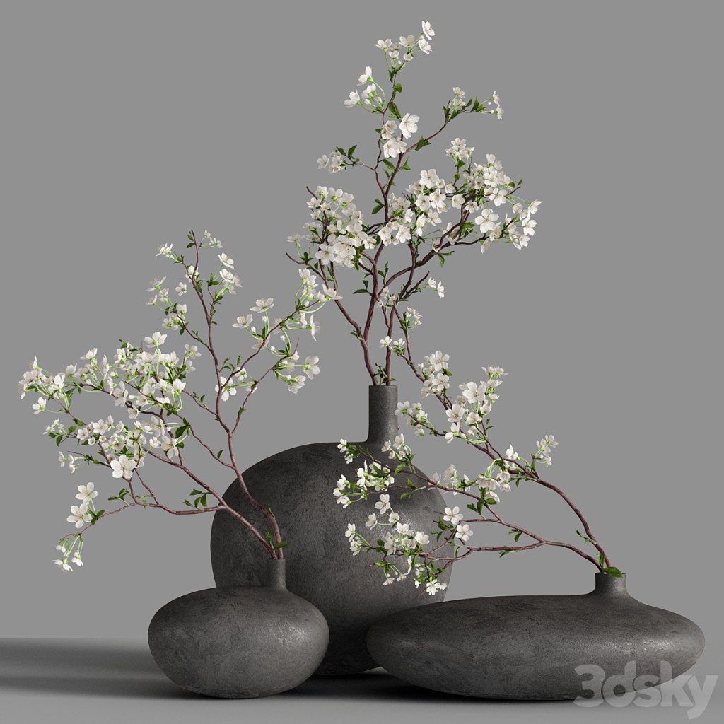 Cherry blossom branches in “Submarine” vases from 101cph